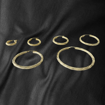 Argollas torcidas, satinadas, grosor 3 mm.  